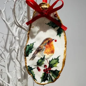 Robin Christmas oyster shell ornament with holly and red ribbon
