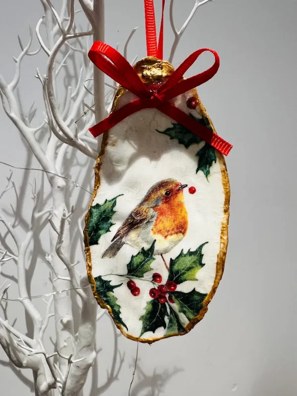 Robin Christmas oyster shell ornament with holly and red ribbon